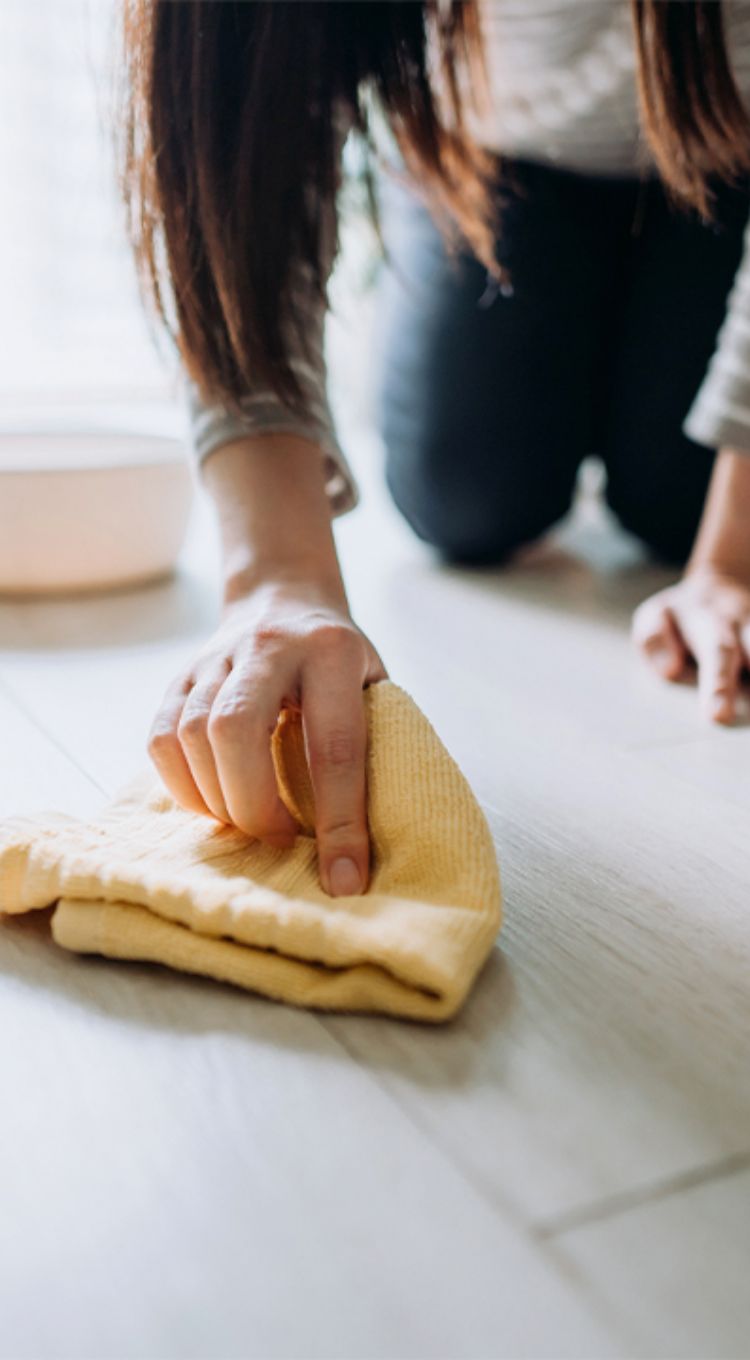 Women wiping up spill on easy care floors 